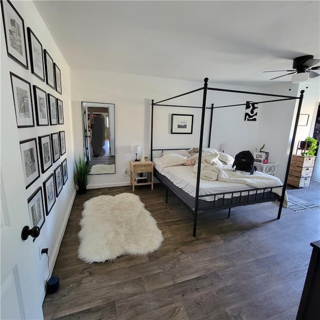 bedroom featuring ceiling fan and dark hardwood / wood-style floors