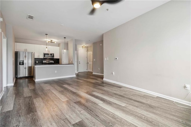 898 Oak St SW Unit 3228, Atlanta, GA 30310 - unfurnished living room with a ceiling fan and wood finished floors