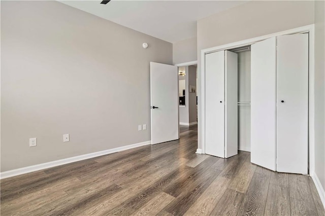 898 Oak St SW Unit 3228, Atlanta, GA 30310 - unfurnished bedroom featuring wood finished floors and a closet