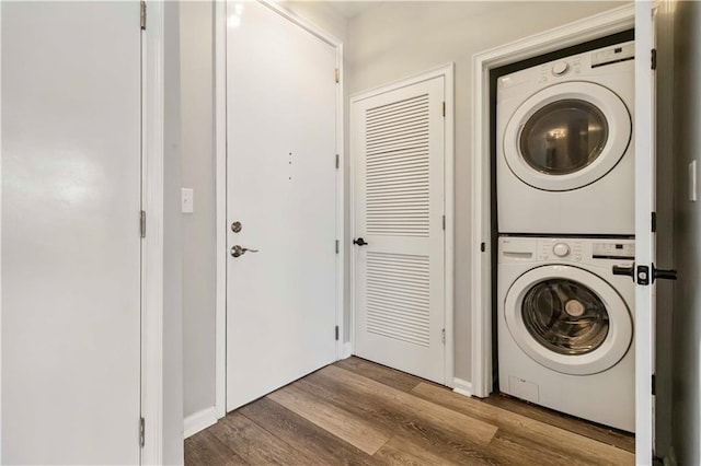898 Oak St SW Unit 3228, Atlanta, GA 30310 - washroom featuring estacked washer and dryer and wood finished floors