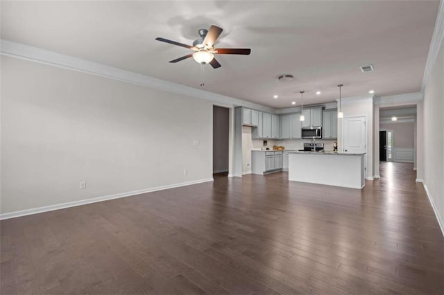 unfurnished living room with crown molding, dark hardwood / wood-style flooring, and ceiling fan