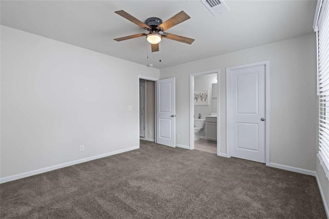 unfurnished bedroom with carpet floors, ensuite bath, and ceiling fan