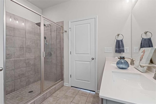 bathroom with tile patterned flooring, double sink vanity, and an enclosed shower