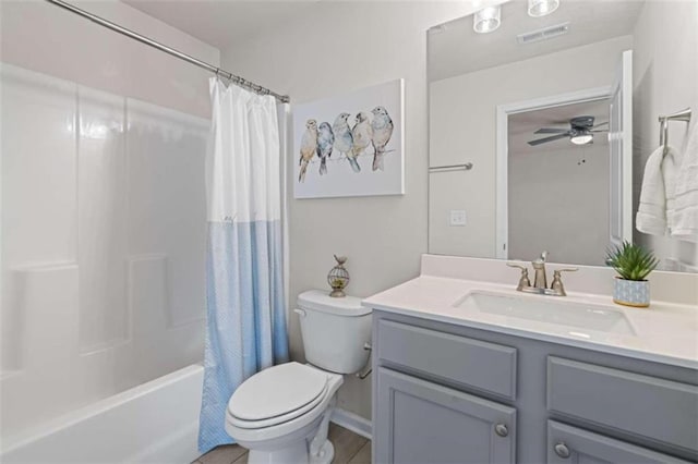 full bathroom with shower / bath combination with curtain, toilet, vanity, and ceiling fan