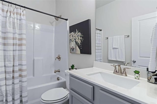 full bathroom with shower / tub combo, toilet, and vanity