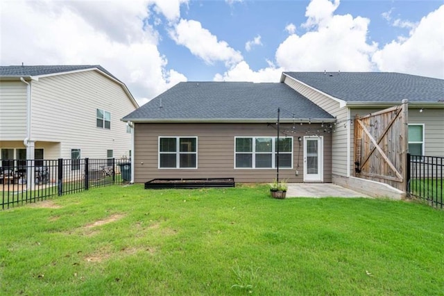 rear view of property with a patio area and a lawn