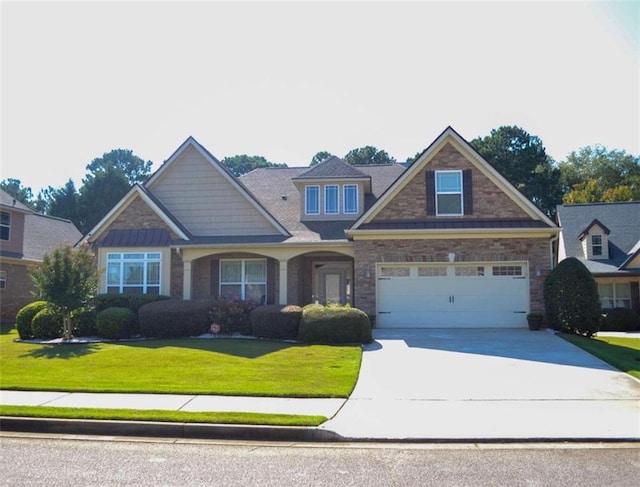 craftsman-style house with a front yard and a garage