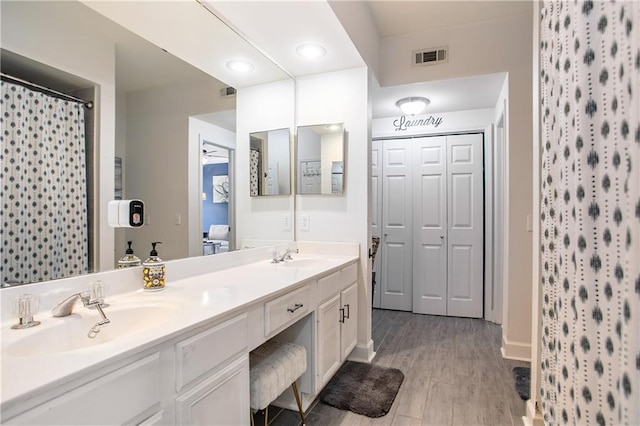 3777 Peachtree Rd NE Unit 1326, Atlanta, GA 30319 - bathroom featuring double vanity and wood finished floors