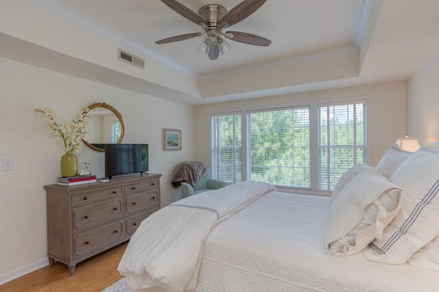 3636 Habersham Rd Unit 2307, Atlanta, GA 30305 - bedroom with light wood-style floors, visible vents, a raised ceiling, and ornamental molding