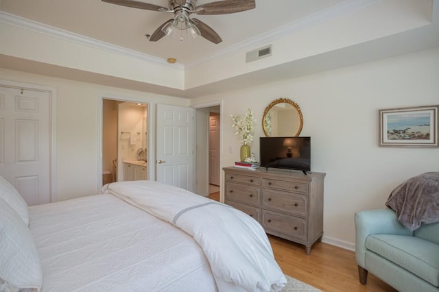 3636 Habersham Rd Unit 2307, Atlanta, GA 30305 - bedroom featuring light wood finished floors, baseboards, visible vents, connected bathroom, and crown molding