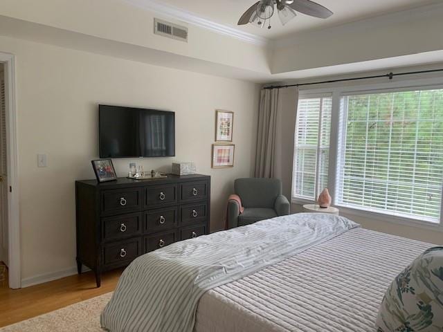 3636 Habersham Rd Unit 2307, Atlanta, GA 30305 - bedroom with light wood finished floors, baseboards, visible vents, a raised ceiling, and ceiling fan