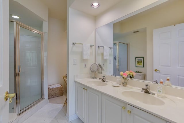 3636 Habersham Rd Unit 2307, Atlanta, GA 30305 - bathroom featuring a sink, toilet, and a shower stall