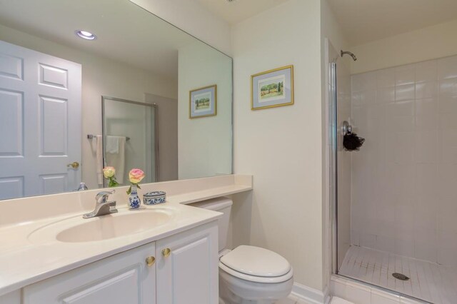 3636 Habersham Rd Unit 2307, Atlanta, GA 30305 - bathroom with toilet, a shower stall, recessed lighting, and vanity