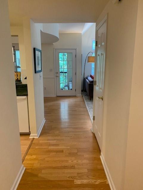 3636 Habersham Rd Unit 2307, Atlanta, GA 30305 - hall featuring light wood-style floors and baseboards