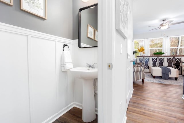 bathroom featuring hardwood / wood-style flooring and ceiling fan