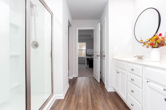 corridor with sink and dark wood-type flooring