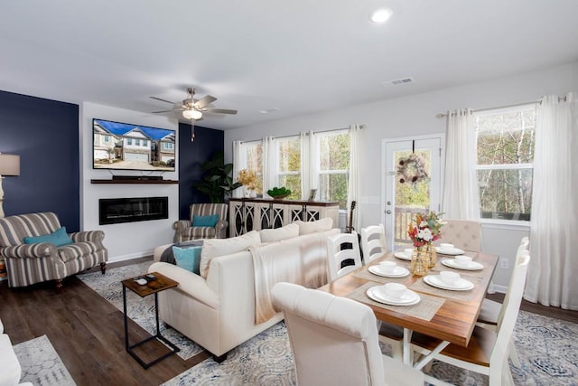 dining space featuring dark hardwood / wood-style flooring and ceiling fan