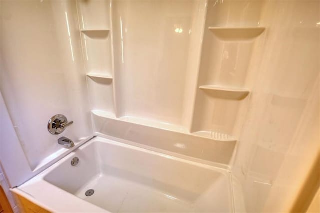 bathroom featuring washtub / shower combination