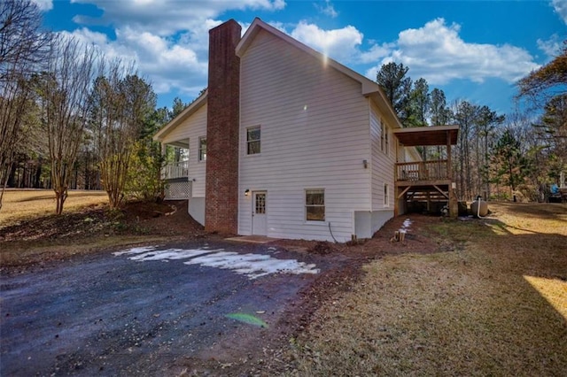 view of side of home with a wooden deck