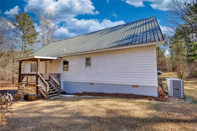 view of side of property featuring central AC unit