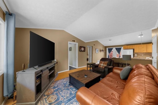 1822 N Rock Springs Rd NE Unit 24, Atlanta, GA 30324 - living area with lofted ceiling and light wood-style flooring