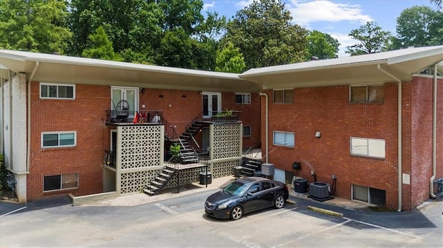 1822 N Rock Springs Rd NE Unit 24, Atlanta, GA 30324 - view of building exterior with stairs and uncovered parking
