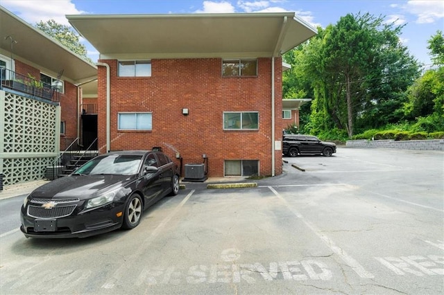 1822 N Rock Springs Rd NE Unit 24, Atlanta, GA 30324 - view of home's exterior with uncovered parking and brick siding