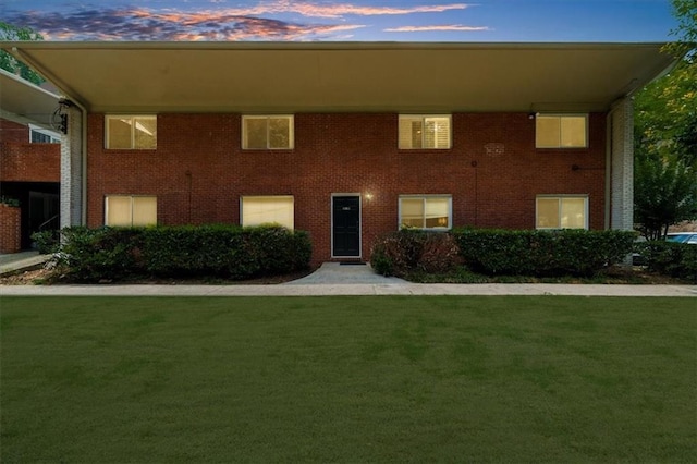 1822 N Rock Springs Rd NE Unit 24, Atlanta, GA 30324 - view of front of property featuring a front yard and brick siding