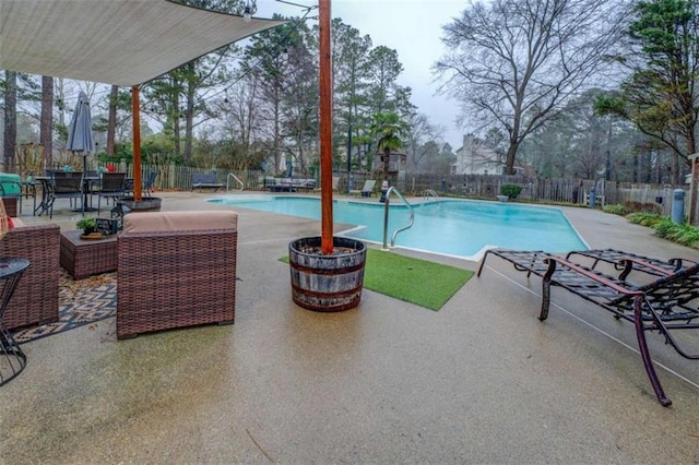 view of swimming pool with a patio