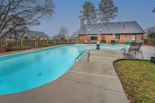 view of swimming pool featuring a patio area