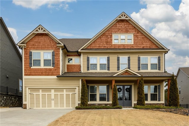 craftsman-style home with french doors and a garage