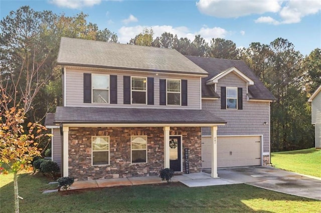 view of front facade with a garage and a front lawn