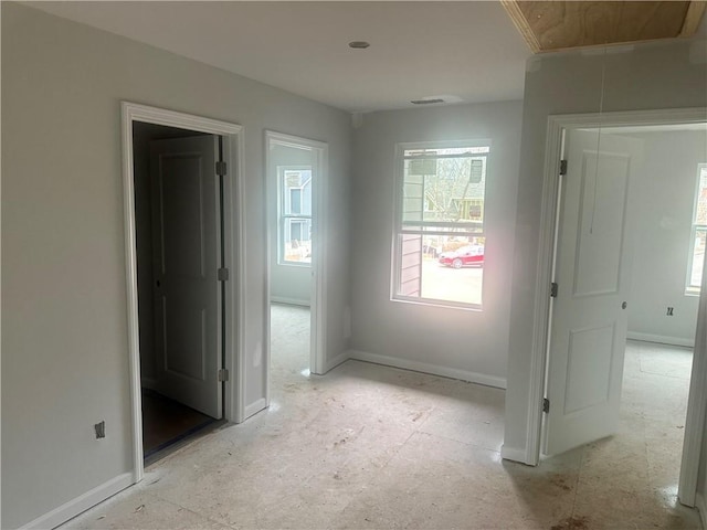 interior space featuring visible vents, attic access, and baseboards