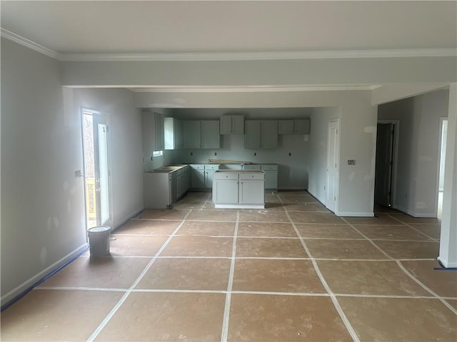 kitchen with baseboards, ornamental molding, light tile patterned flooring, and gray cabinetry