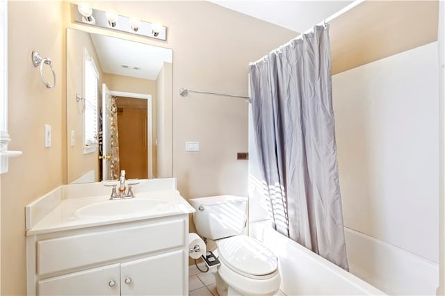 full bathroom with tile patterned floors, vanity, shower / tub combo, and toilet