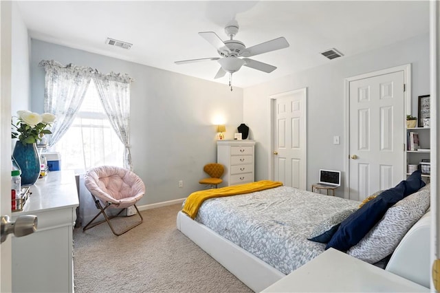 bedroom featuring light carpet and ceiling fan