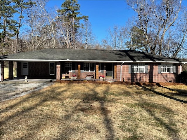 view of front of home featuring a porch, brick siding, driveway, crawl space, and a front lawn