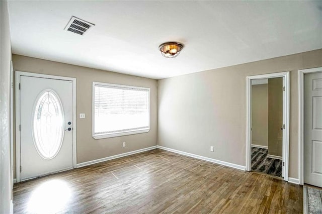 entryway with hardwood / wood-style floors