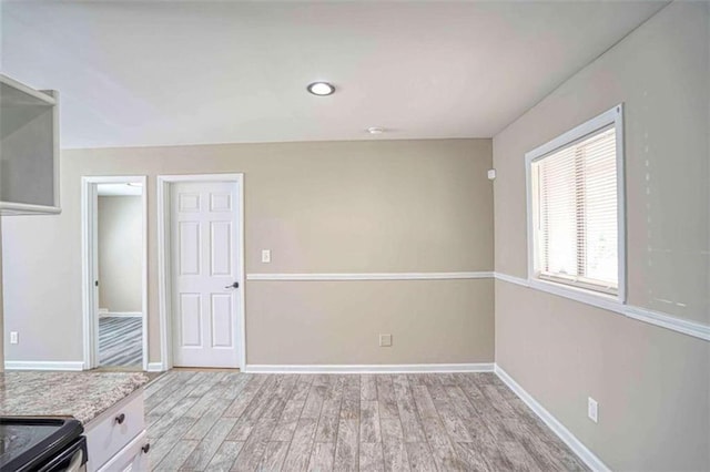 kitchen featuring white cabinets and light hardwood / wood-style floors