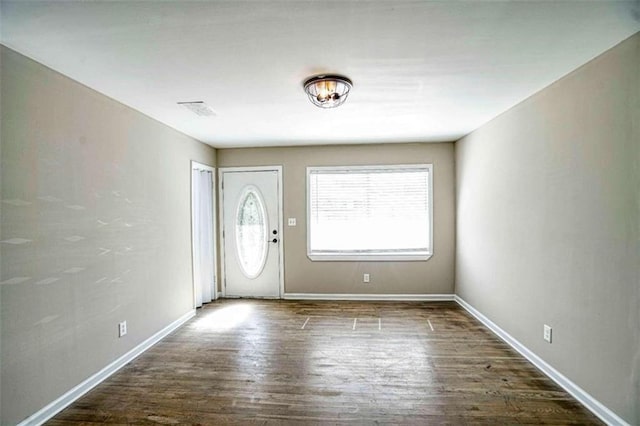 entrance foyer with dark hardwood / wood-style floors