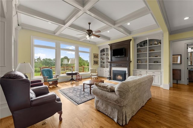 4645 Manor Dr, Gainesville, GA 30506 - living area with a lit fireplace, healthy amount of natural light, ceiling fan, wood finished floors, and beamed ceiling
