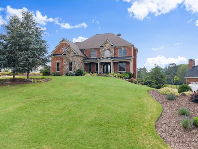 4645 Manor Dr, Gainesville, GA 30506 - craftsman-style house with a front yard, stone siding, and brick siding