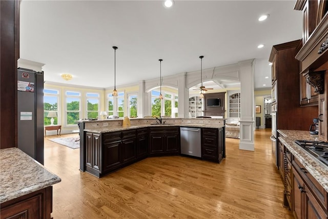 4645 Manor Dr, Gainesville, GA 30506 - kitchen with stainless steel appliances, plenty of natural light, light wood finished floors, recessed lighting, and ornamental molding