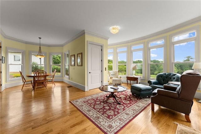 4645 Manor Dr, Gainesville, GA 30506 - living area featuring ornamental molding, light wood-type flooring, and baseboards