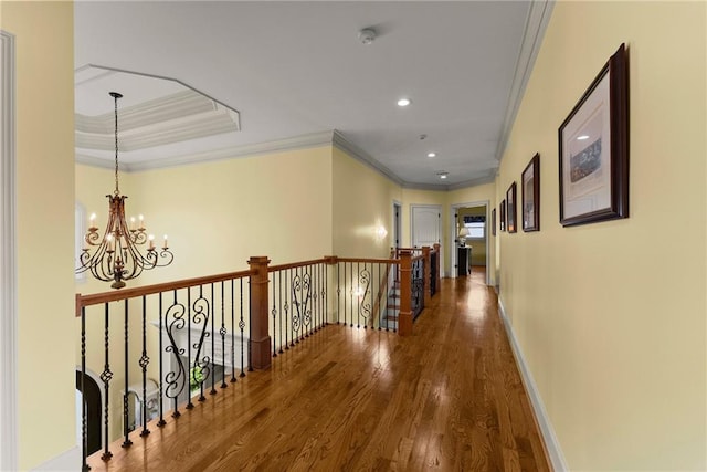 4645 Manor Dr, Gainesville, GA 30506 - hallway featuring ornamental molding, wood finished floors, a chandelier, recessed lighting, and baseboards