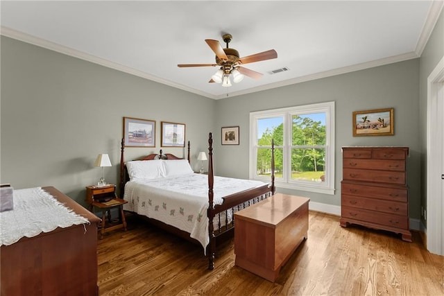 4645 Manor Dr, Gainesville, GA 30506 - bedroom featuring ornamental molding, light wood finished floors, baseboards, and a ceiling fan