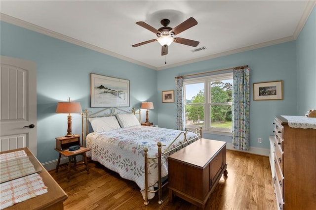 4645 Manor Dr, Gainesville, GA 30506 - bedroom featuring crown molding, light wood-type flooring, baseboards, and a ceiling fan