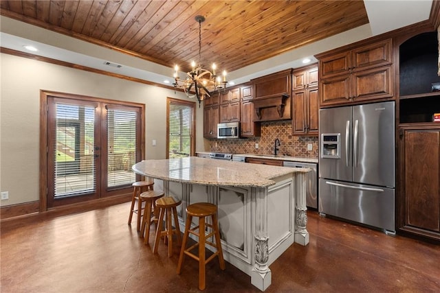 4645 Manor Dr, Gainesville, GA 30506 - kitchen with appliances with stainless steel finishes, finished concrete flooring, wooden ceiling, a kitchen island, and backsplash