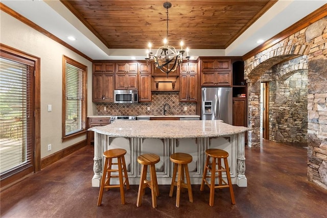 4645 Manor Dr, Gainesville, GA 30506 - kitchen with stainless steel appliances, a raised ceiling, tasteful backsplash, a chandelier, and concrete flooring