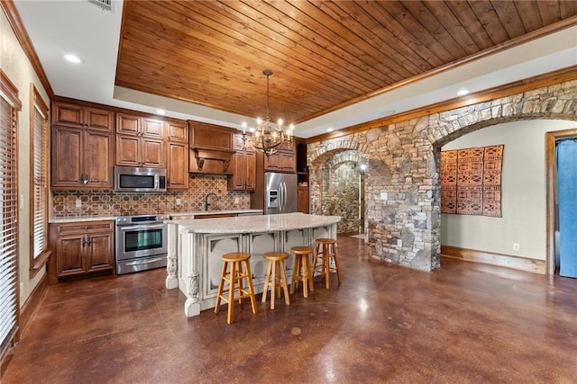 4645 Manor Dr, Gainesville, GA 30506 - kitchen with stainless steel appliances, wooden ceiling, finished concrete floors, arched walkways, and a raised ceiling